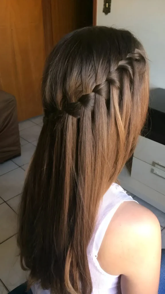 Back view of long, straight brown hair featuring a horizontal waterfall braid across the upper section.