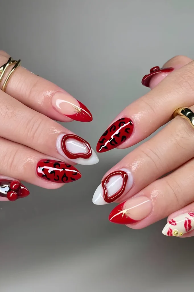 Mixed nail art on almond nails featuring red French tips, leopard print, 3D details, and lip prints.