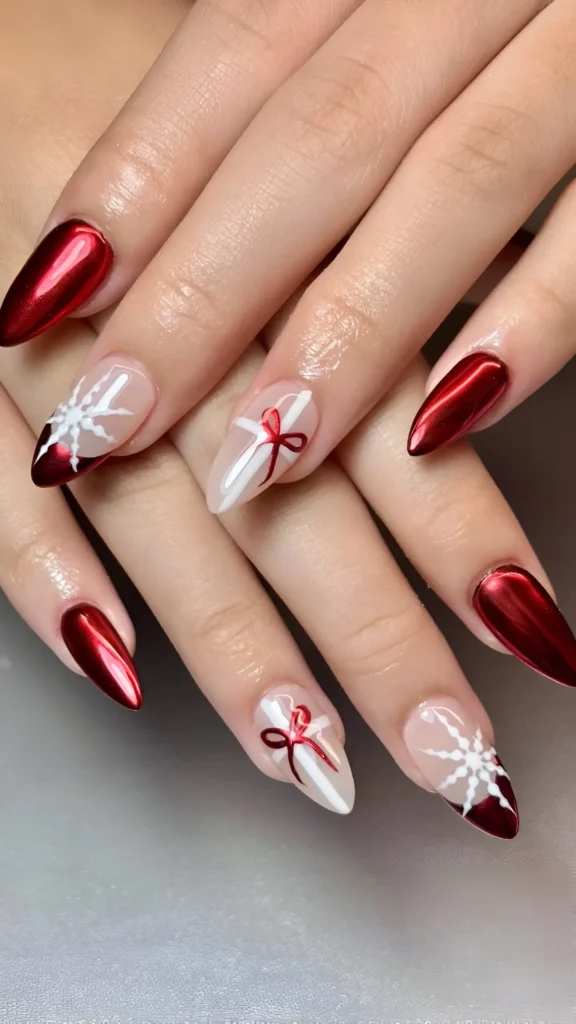 Pointed almond nails with metallic red chrome, white snowflake designs, and red bow outline art.