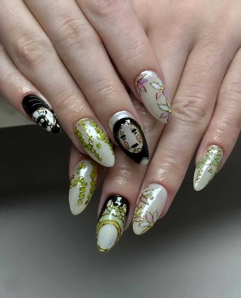 Intricate nail art with illustrative stylized faces, outlined florals, and textured green vines on pale base.