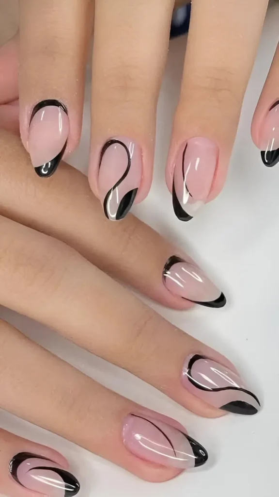Nails with a sheer nude base featuring abstract designs made of thin black lines flowing into solid black curved shapes.