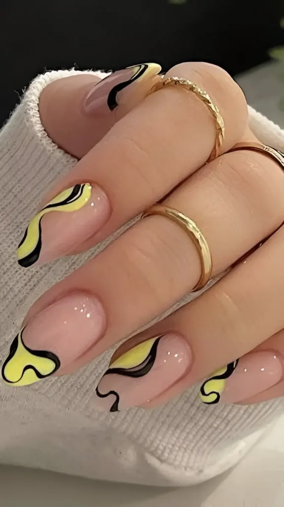 Oval/almond nails with a sheer pink base featuring abstract pastel yellow swirl shapes outlined in black.