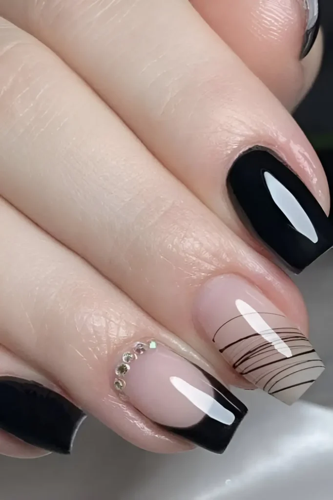 Square nails with mixed design: glossy black, black French tip with rhinestone cuticle cuff, and sheer nail with fine black crosshatch line pattern.