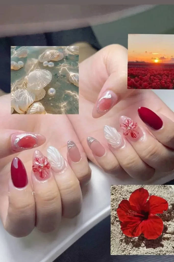 Almond summer nails with deep red polish, white sculpted wing texture, silver chrome accents, and 3D red hibiscus flowers.