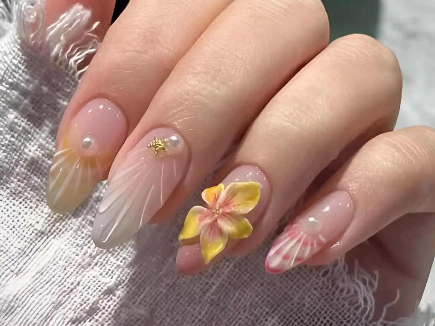 Cute Pink Nail Designs thumbnail featuring ethereal sculpted 3D flowers and shells with pearl accents.
