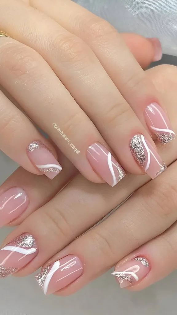 Cute pink nail design with abstract white and silver glitter curve line art.