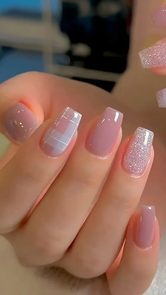 Cute mauve pink nail design with silver glitter accent nail and white grid pattern accent.