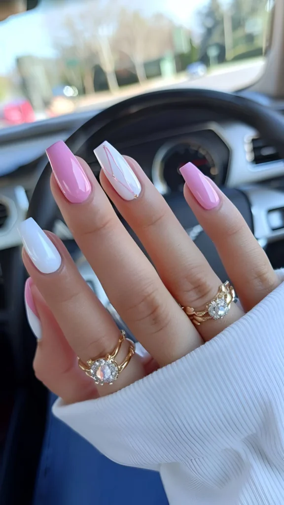 Cute pink and white nail design with gold abstract line art on white accent nail.