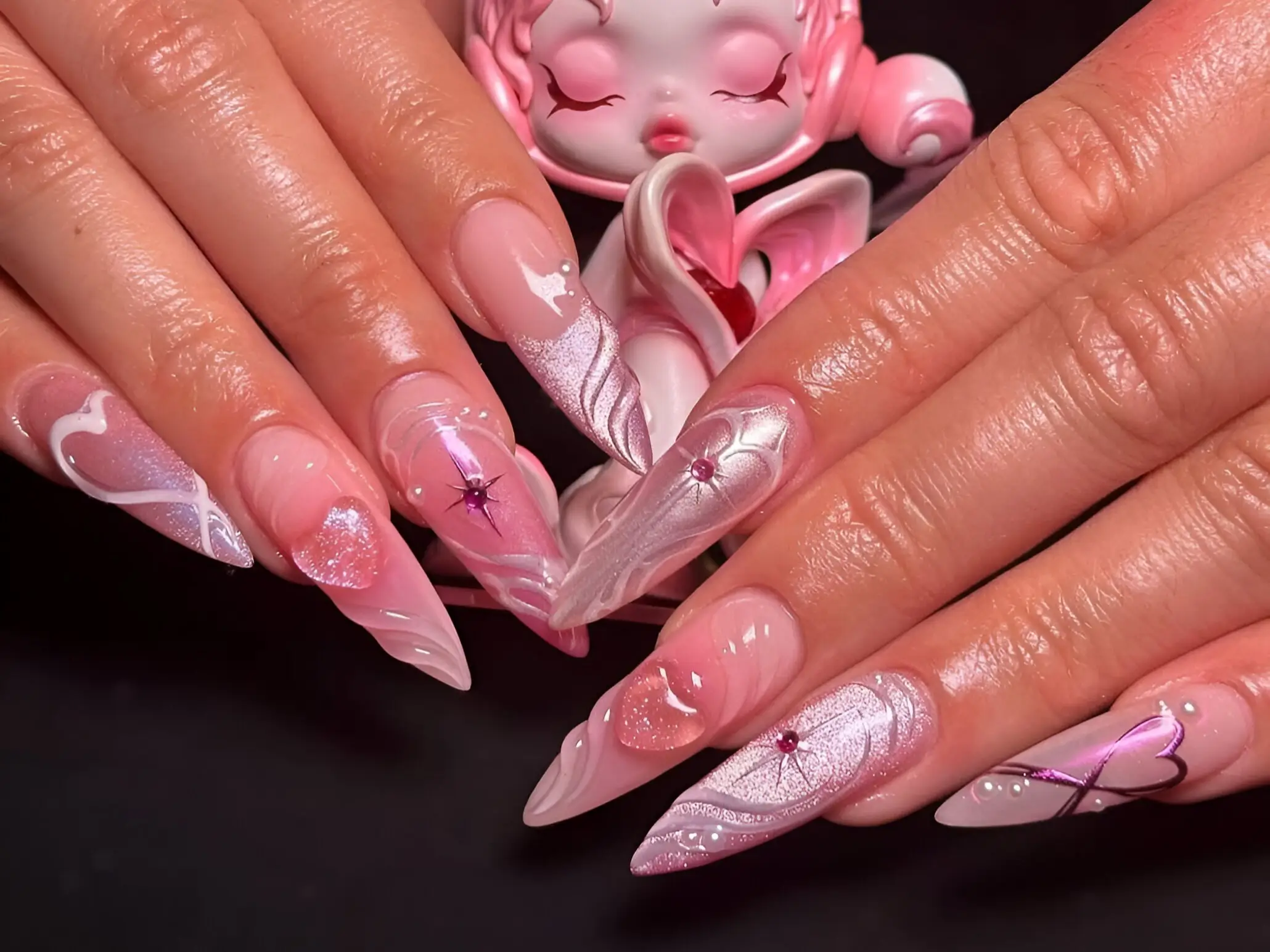 Pink 3D magical girl fantasy nail art on long stiletto nails - trending nail design inspiration.
