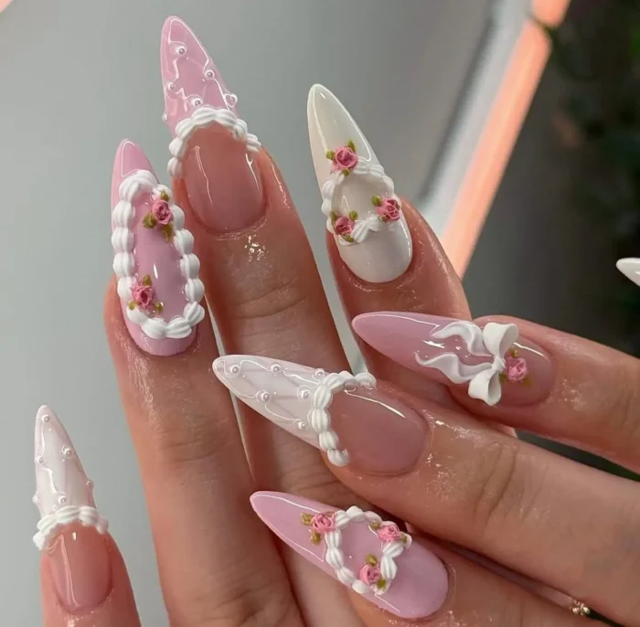 An opulent Rococo-inspired 3D nail art design with details resembling vintage cake icing, ruffles, and tiny sculpted roses.