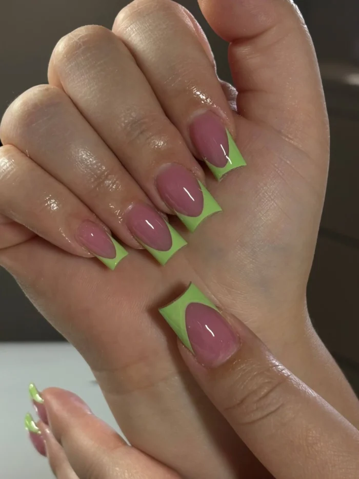 Medium square-shaped nails with bright lime green French tips featuring a deep U-shaped smile line on a sheer pink base.