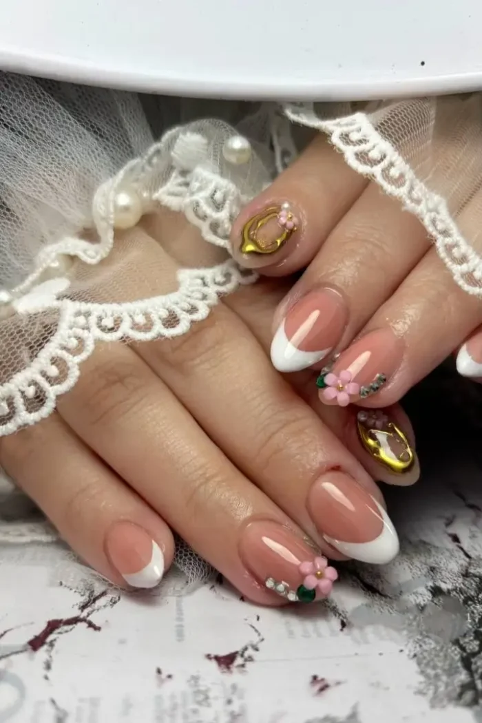A perfect classic French manicure on medium-length almond-shaped nails with a glossy finish.