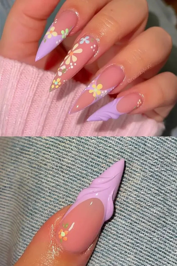 An extravagant manicure on long stiletto nails with a milky white base, featuring white 3D flowers and crystal embellishments.
