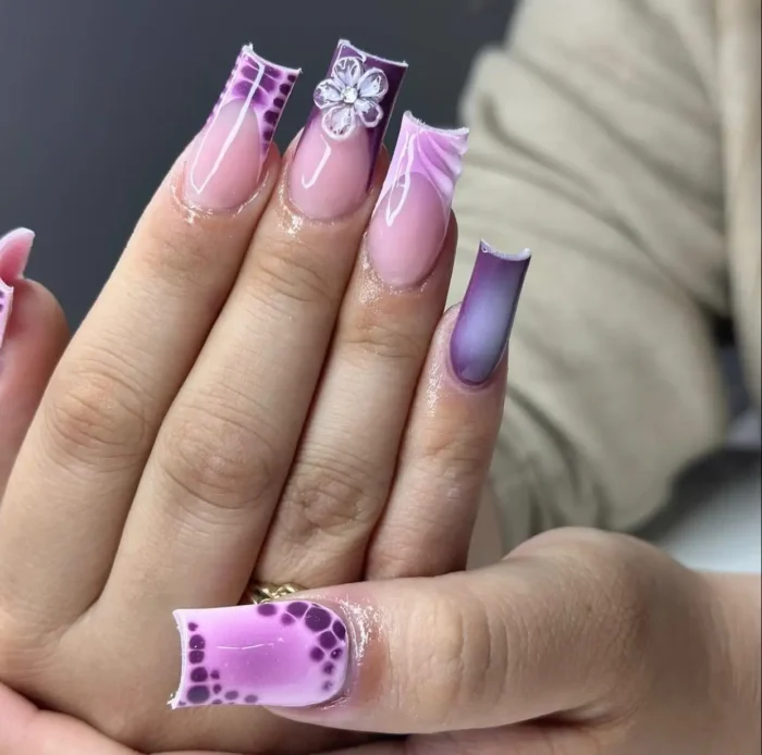 Long flared square nails with a mod purple blooms nail design, featuring purple animal print tips and a 3D flower.
