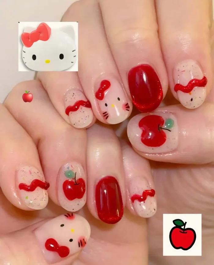 Short rounded nails with a mixed design: solid red polish, sheer glitter base with character kitty faces, and 3D textured red apple and ribbon details.