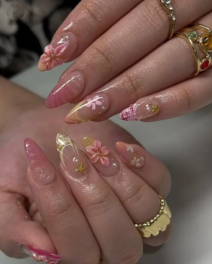 Long almond jelly nails with a trendy summer design featuring delicate plaid patterns, sweet 3D flowers, and gold star accents.
