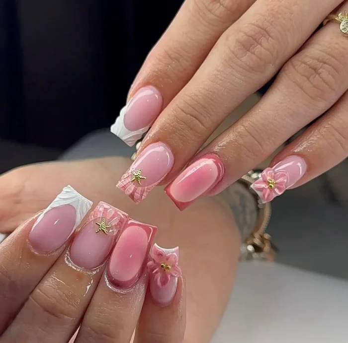 Short square nails with a charming summer design mixing sweet pink plaid, elegantly sculpted white French tips, 3D flowers, and starfish charms.