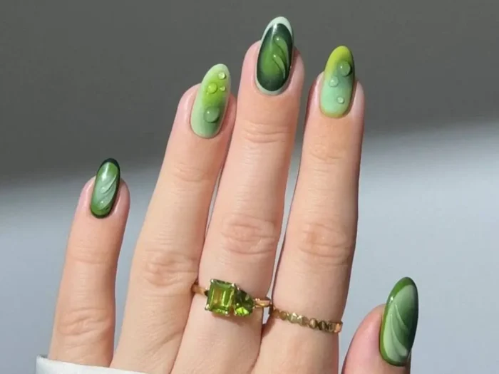 Featured image for an ultimate guide to 29 trending green nail designs, showcasing diverse styles from subtle to bold looks.