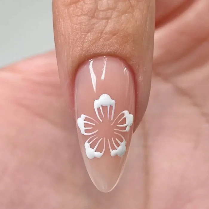 Step four of a hibiscus nail art tutorial, showing fine white lines being drawn inside each petal to create texture and dimension.
