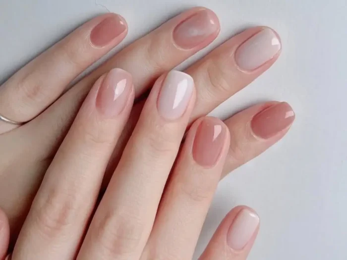 Inspiring examples of simple nail designs for short nails, showcasing an elegant manicure with mixed nude and rosy tones.