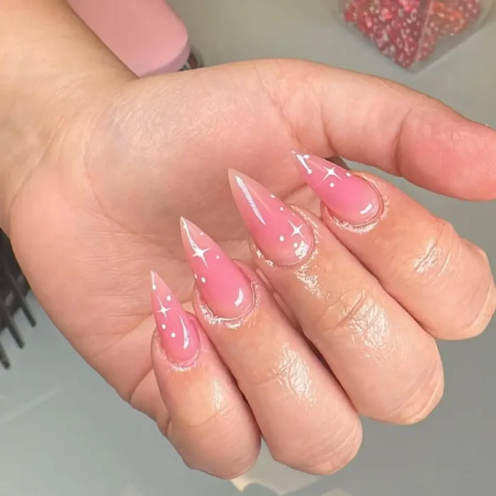 Sheer jelly pink stiletto nails with a minimalist white sparkle design.